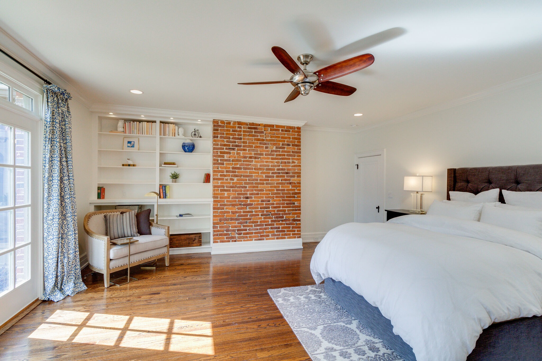 116 Mockingbird Road Nashville, TN 37205 - Photo 27 of 43 a spacious bedroom with a large bed and a chandelier