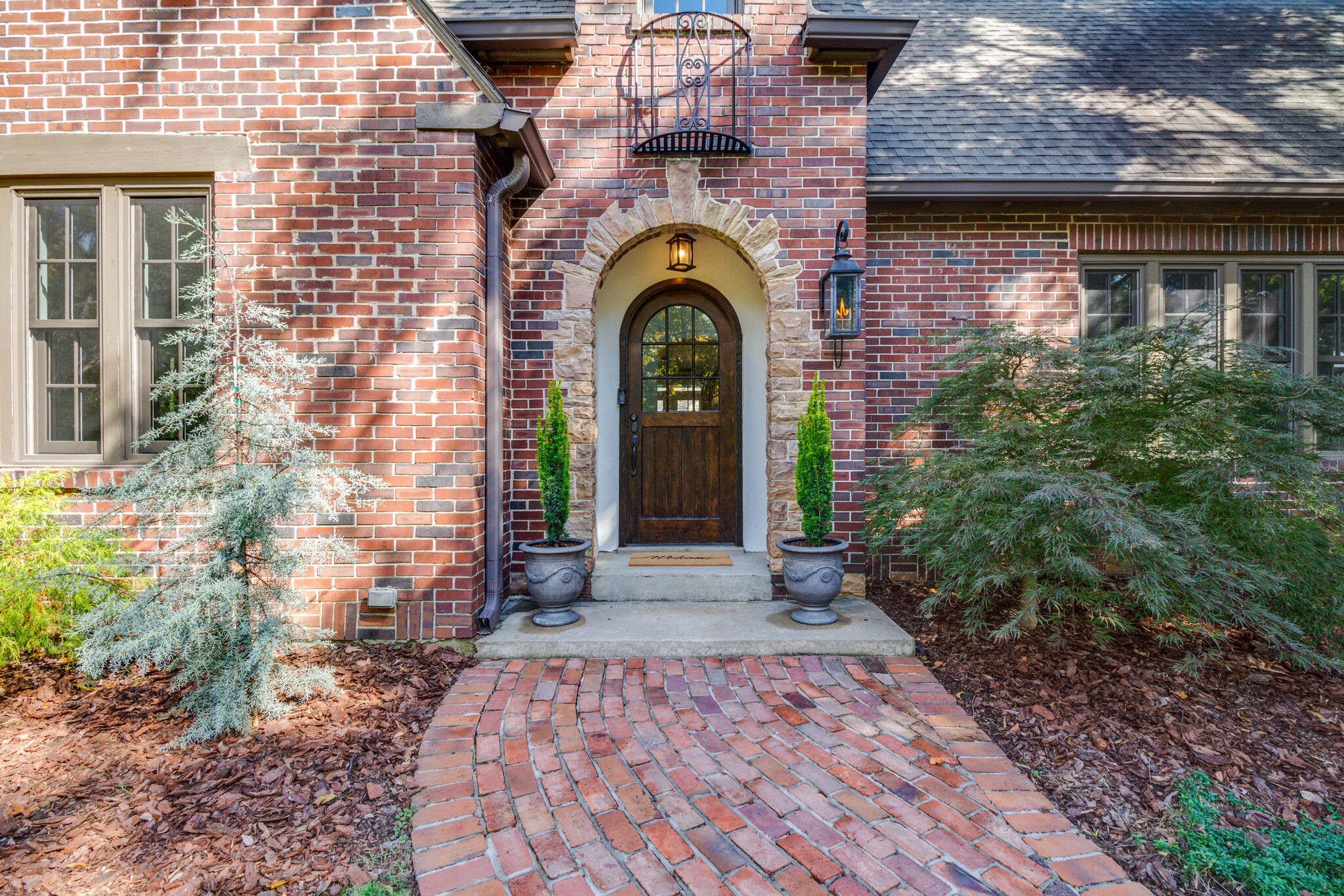 116 Mockingbird Road Nashville, TN 37205 - Photo 4 of 43 a front view of a house with garden