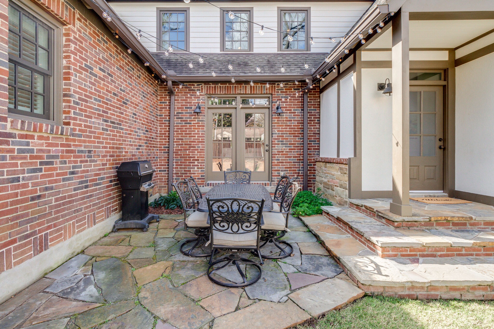 116 Mockingbird Road Nashville, TN 37205 - Photo 39 of 43 a view of a porch with chairs and table in a patio