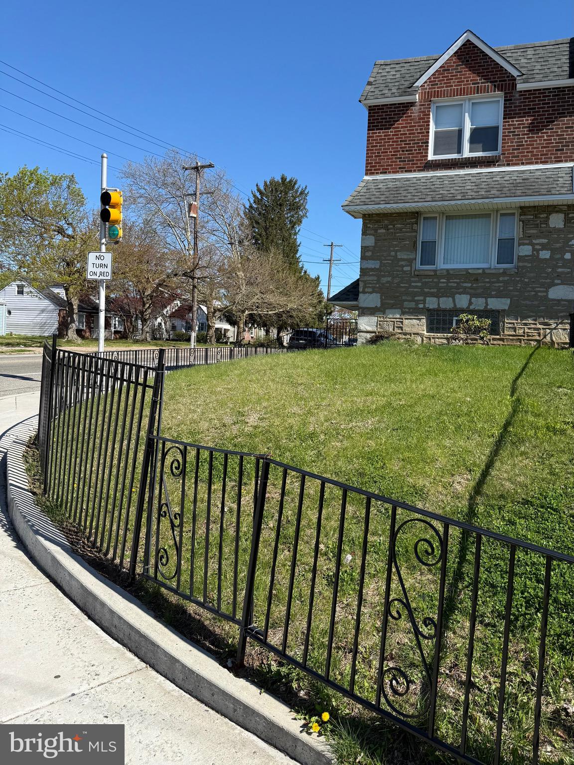 9083 Convent Avenue Philadelphia, PA 19136 - Photo 2 of 22 a view of a brick house with wooden fence