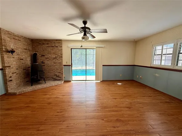 a bathroom with a sink mirror and shower