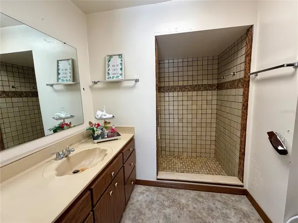 a view of a workspace with furniture and a chandelier