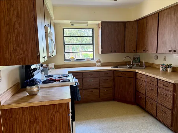 a bathroom with a sink a mirror and a shower