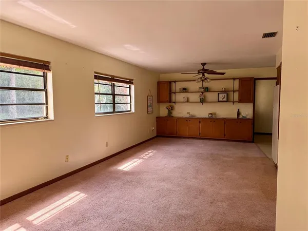 a view of a backyard with a small cabin