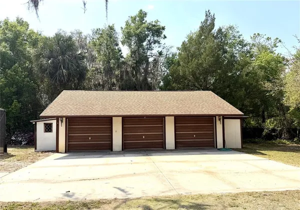 a kitchen with a appliances a table and chairs