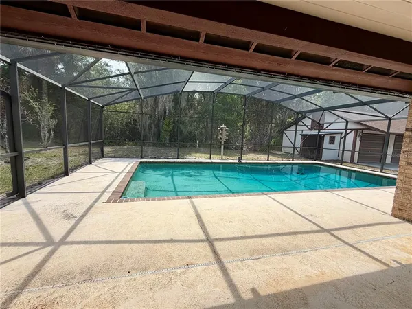 a front view of a house with yard patio and green space
