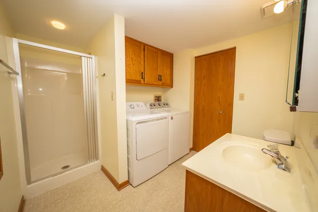 an empty room with a ceiling fan and a window