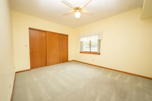 a sign that is sitting on a sidewalk