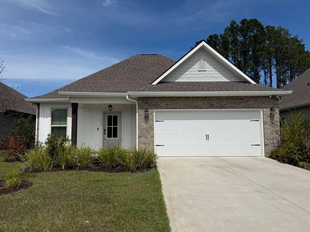 115 Apollo Avenue Freeport, FL 32439 - Photo 1 of 26 front view of house with a yard