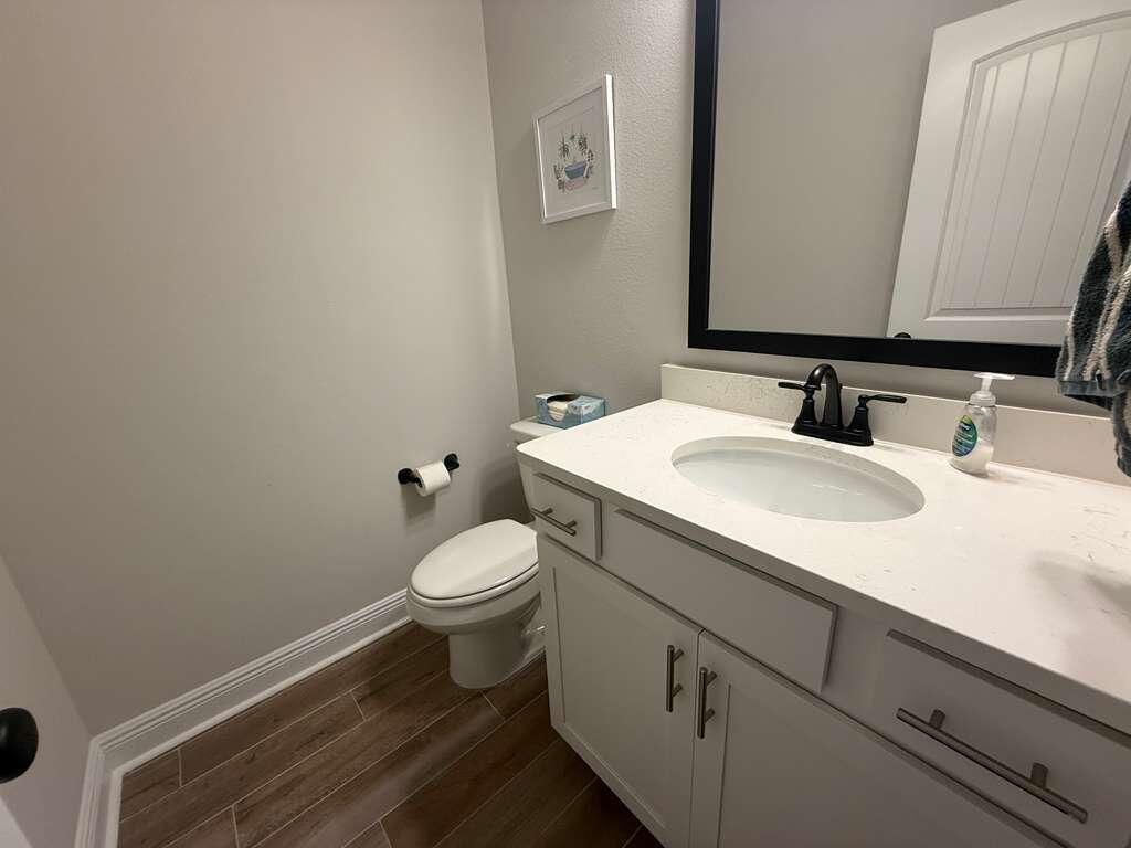 115 Apollo Avenue Freeport, FL 32439 - Photo 11 of 26 a bathroom with a sink a toilet and mirror