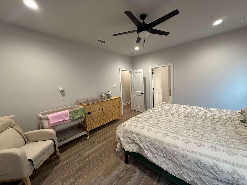 115 Apollo Avenue Freeport, FL 32439 - Photo 13 of 26 a bedroom with bed and a couch
