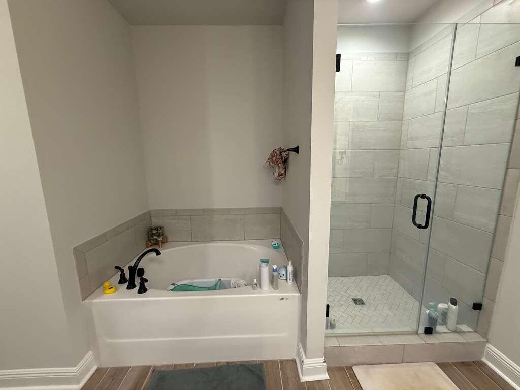 115 Apollo Avenue Freeport, FL 32439 - Photo 15 of 26 a white bath tub sitting next to a shower