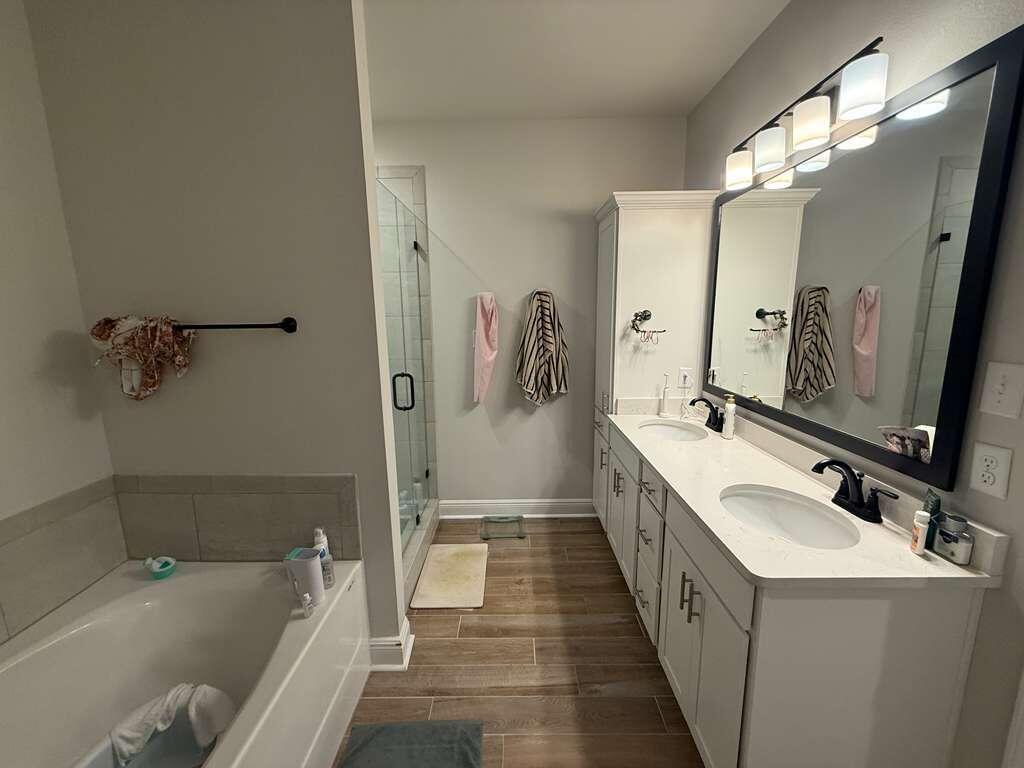 115 Apollo Avenue Freeport, FL 32439 - Photo 16 of 26 a bathroom with a tub sink and mirror