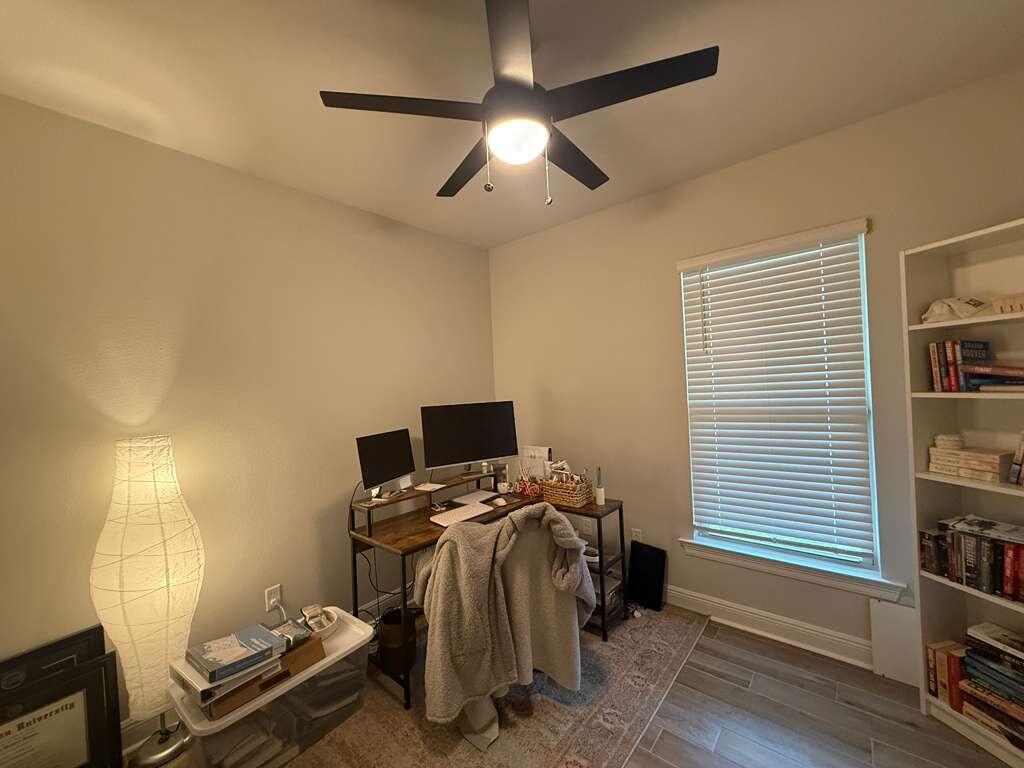 115 Apollo Avenue Freeport, FL 32439 - Photo 17 of 26 a bedroom with a bed and a chandelier