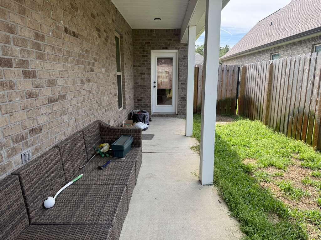 115 Apollo Avenue Freeport, FL 32439 - Photo 21 of 26 a backyard of a house with seating space