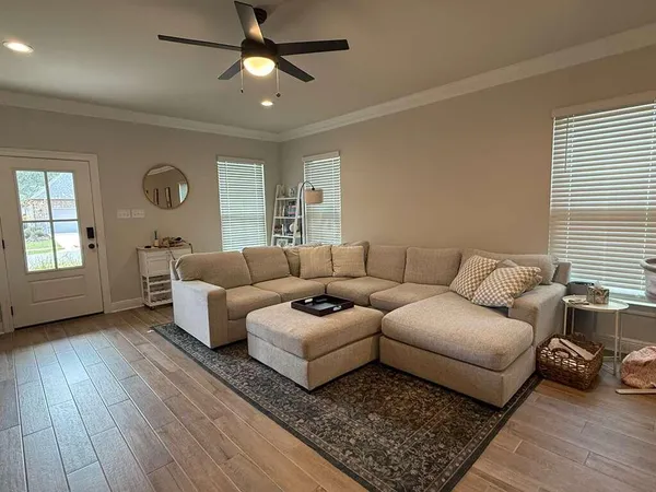 a living room with furniture and a window