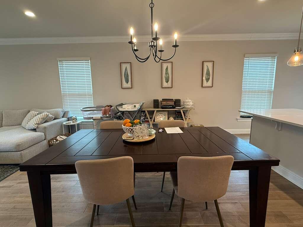 115 Apollo Avenue Freeport, FL 32439 - Photo 8 of 26 a view of a dining room with furniture and chandelier