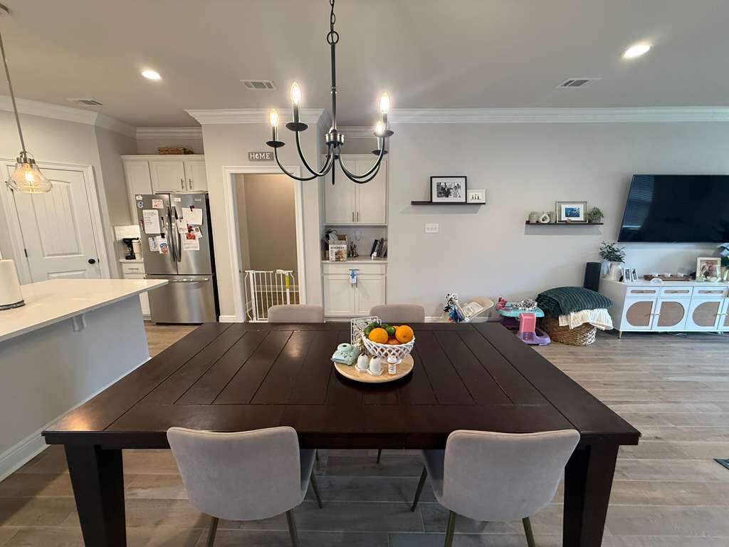 115 Apollo Avenue Freeport, FL 32439 - Photo 9 of 26 a view of kitchen and dining area with furniture