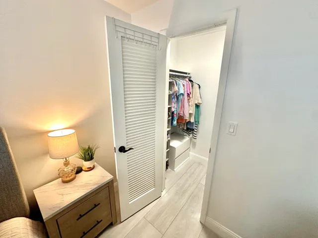 a view of a bedroom with bathroom