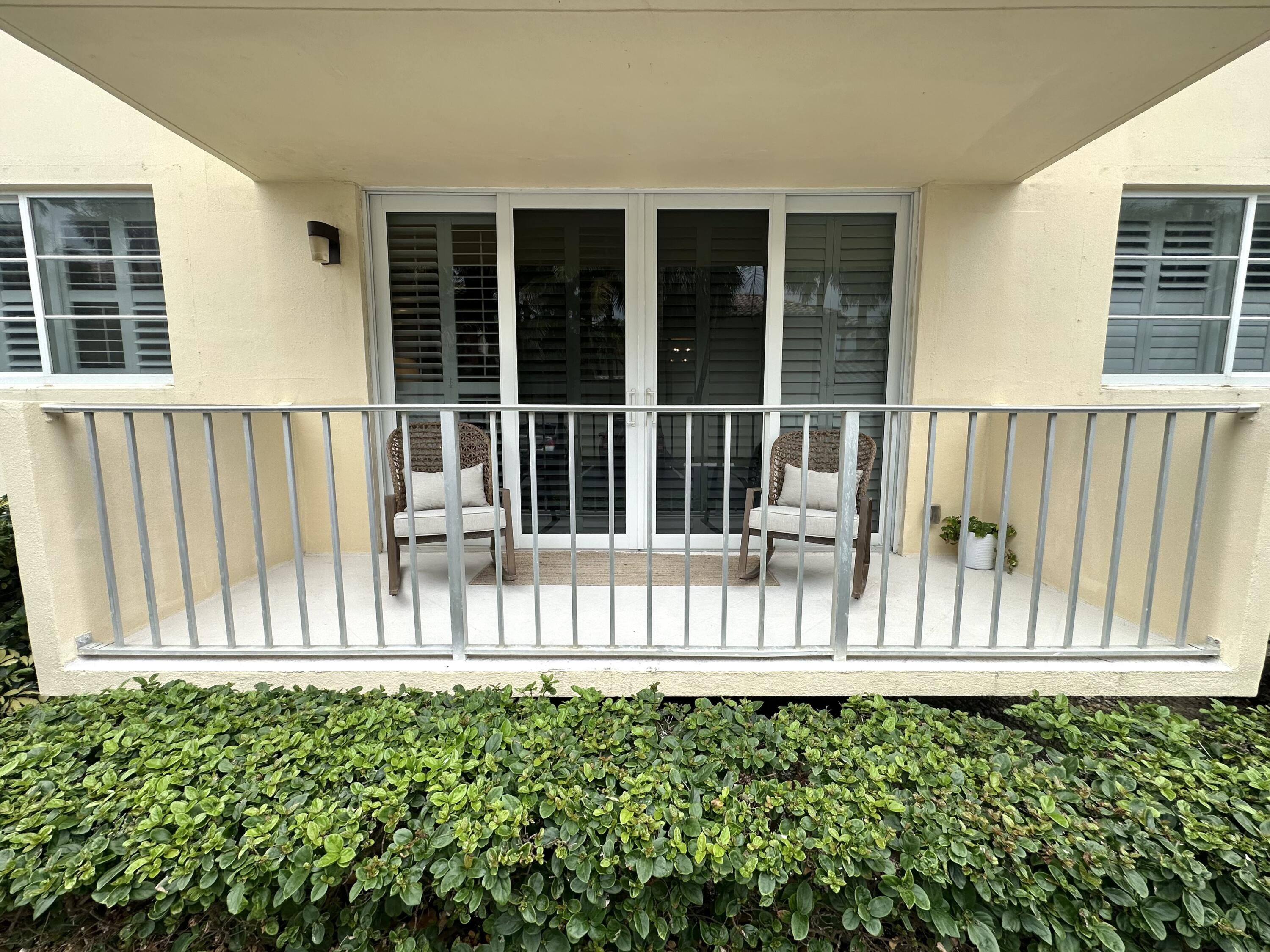 630 Ocean Drive, Unit 105 Juno Beach, FL 33408 - Photo 27 of 37 a view of a house with a fence