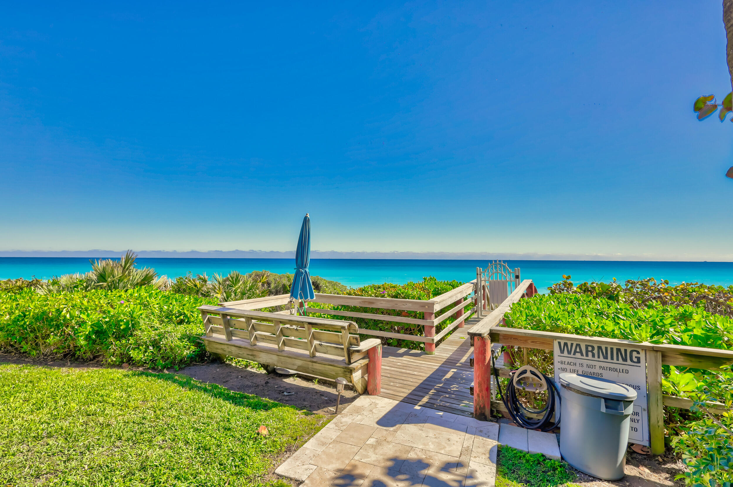 630 Ocean Drive, Unit 105 Juno Beach, FL 33408 - Photo 37 of 37 a view of a backyard with sitting area