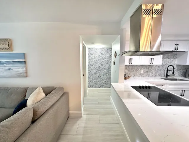 a living room with a couch and a large window