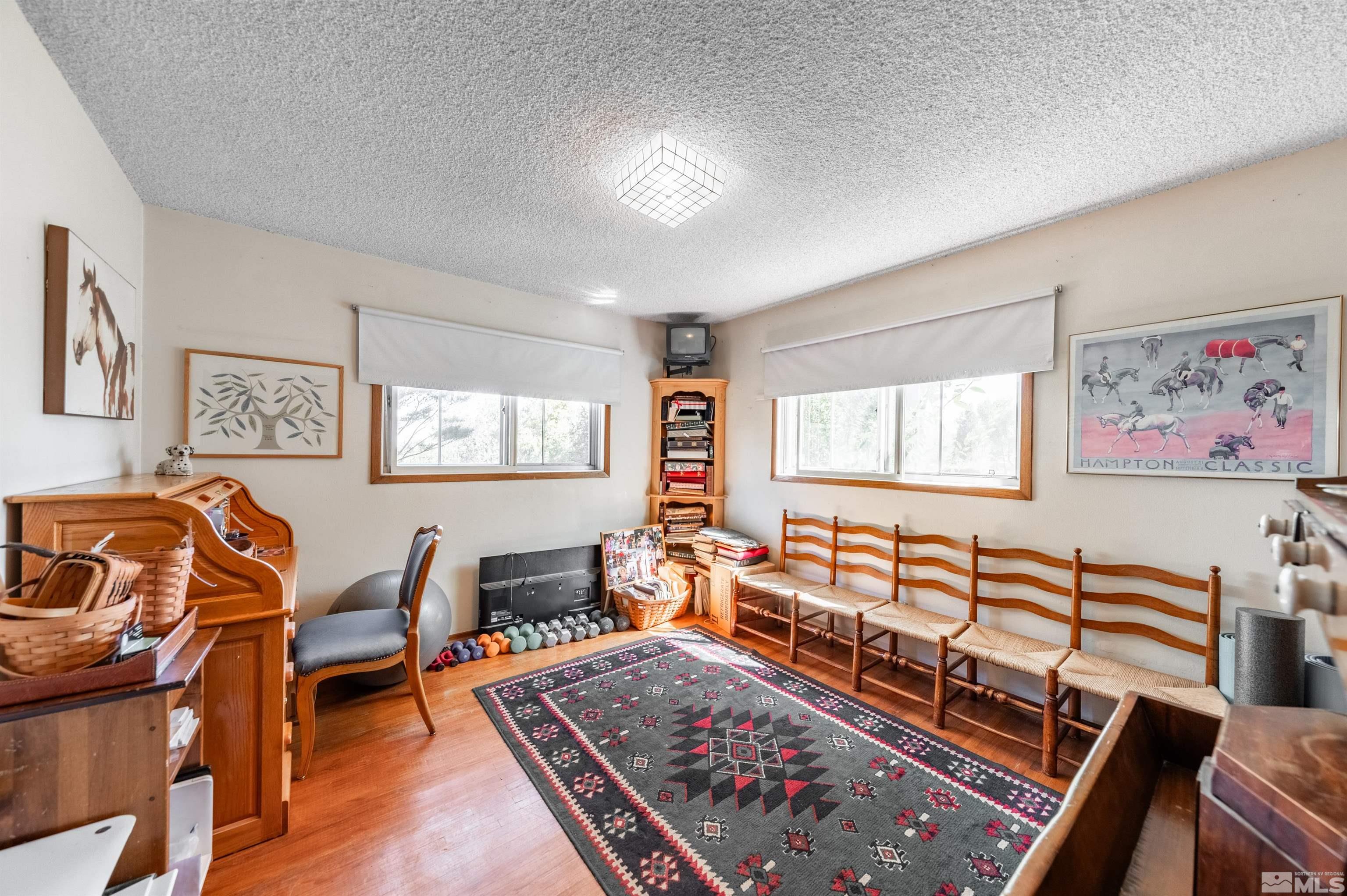 9820 Dixon Lane Reno, NV 89511 - Photo 15 of 40 a living room with furniture and a wooden floor