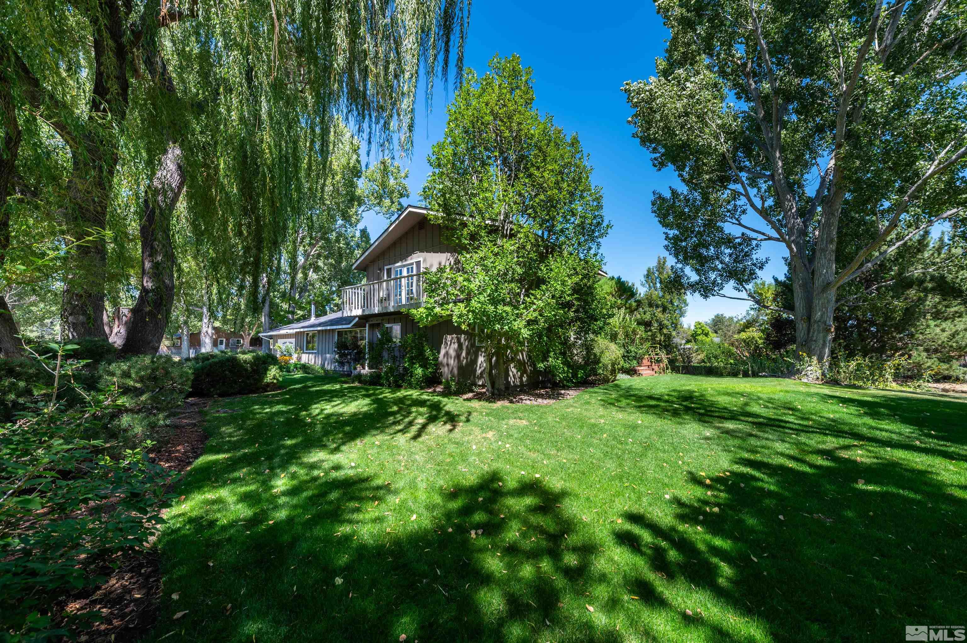 9820 Dixon Lane Reno, NV 89511 - Photo 24 of 40 a backyard of a house with lots of green space