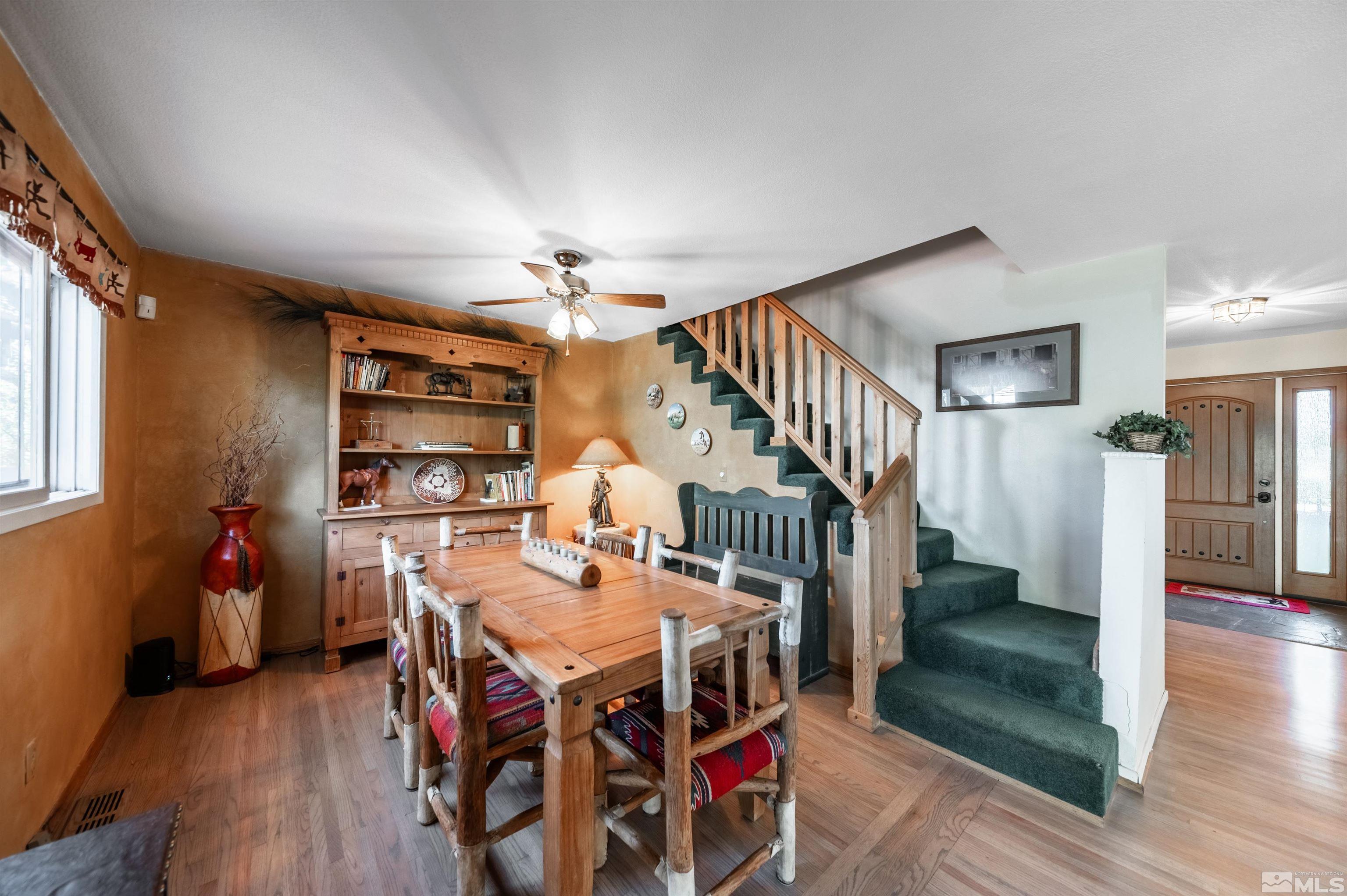 9820 Dixon Lane Reno, NV 89511 - Photo 9 of 40 a dining room with furniture entryway and wooden floor