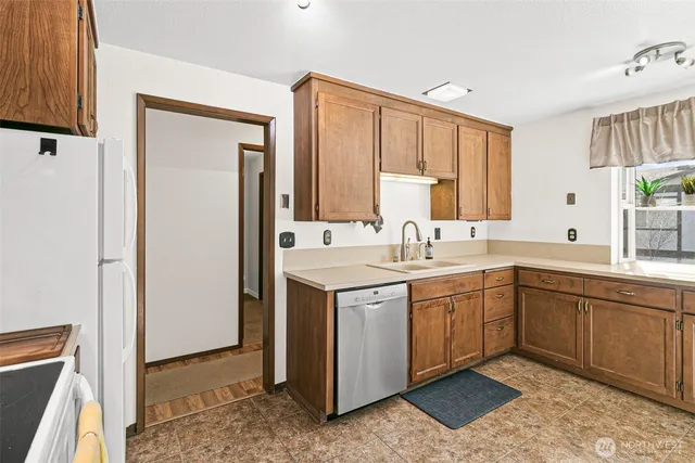 a spacious bathroom with a double vanity sink and a mirror