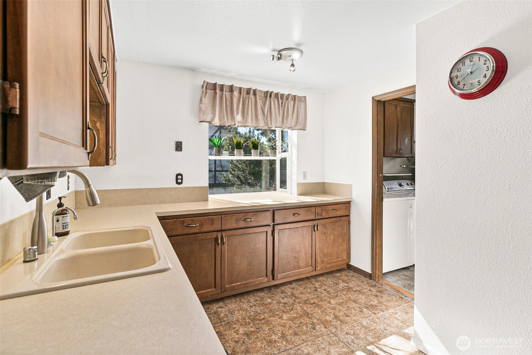 2520 Cascade Place West, Unit 2520 University Place, WA 98466 - Photo 13 of 35 a kitchen with a sink and a stove top oven