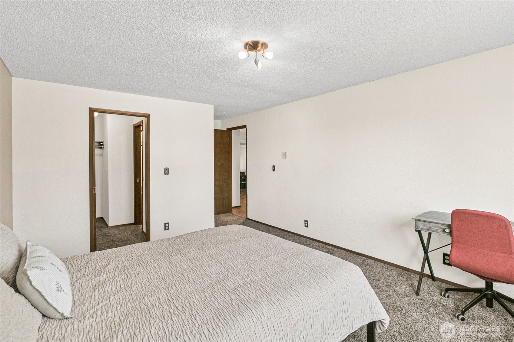 2520 Cascade Place West, Unit 2520 University Place, WA 98466 - Photo 17 of 35 a bedroom with a bed a chair and potted plant