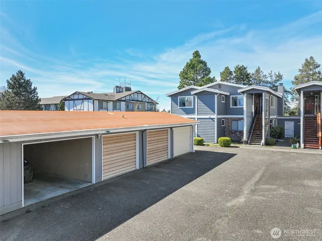 an aerial view of residential house with outdoor space and parking