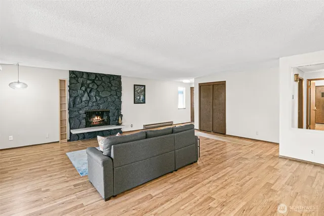 a living room with furniture and a fireplace