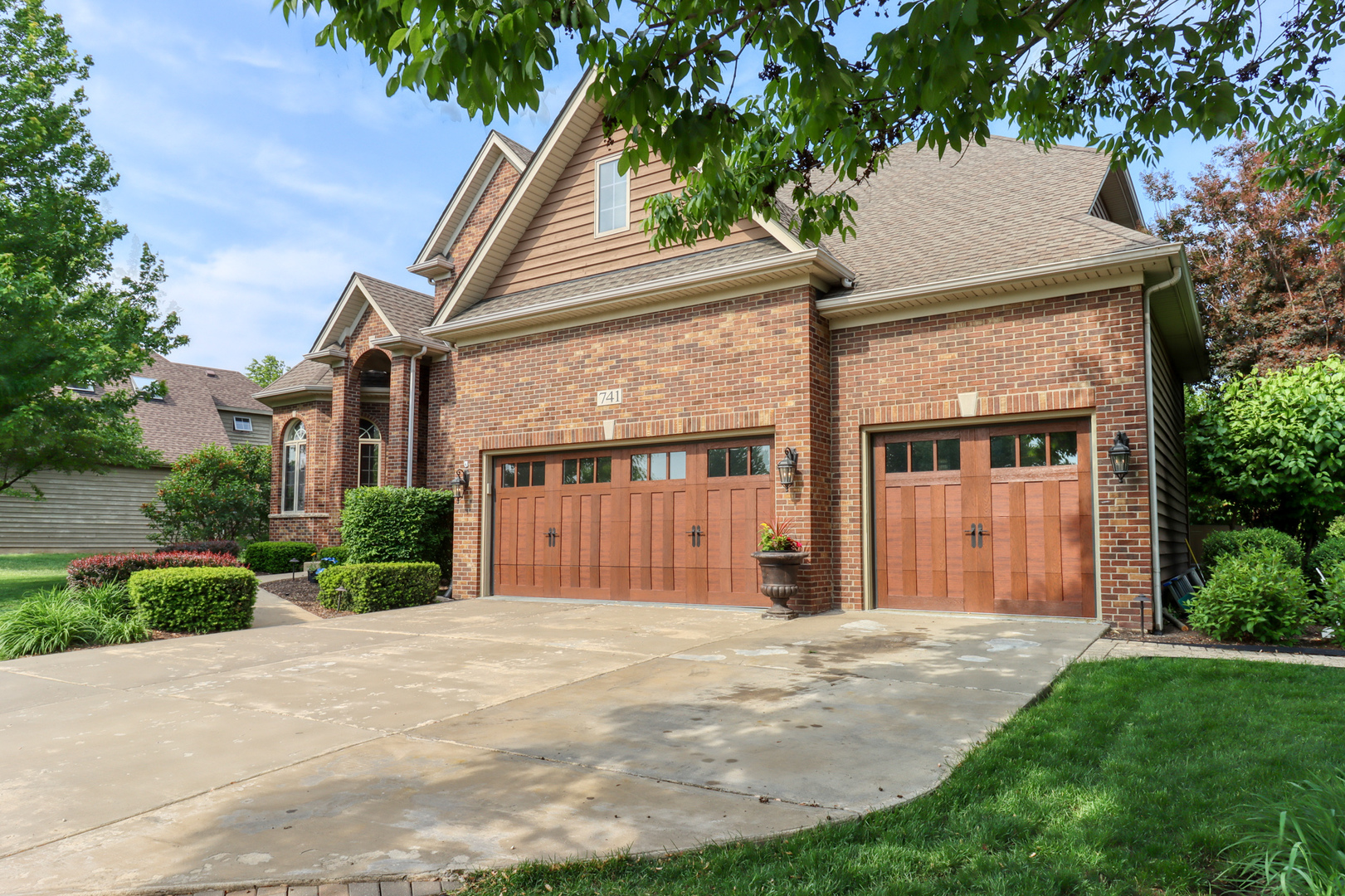 741 Merrill New Road Sugar Grove, IL 60554 - Photo 2 of 42 a front view of a house with a garden