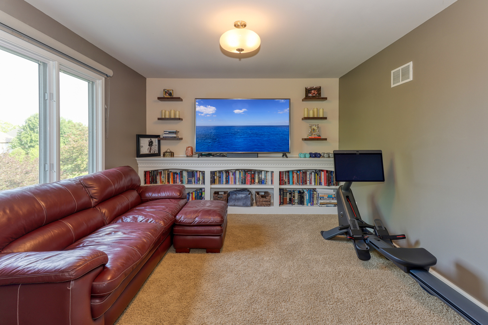 741 Merrill New Road Sugar Grove, IL 60554 - Photo 29 of 42 a living room with furniture gym equipment and a large window