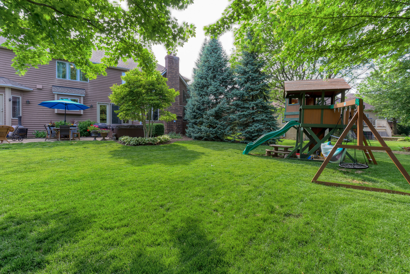 741 Merrill New Road Sugar Grove, IL 60554 - Photo 40 of 42 a view of a house with a backyard and a slide