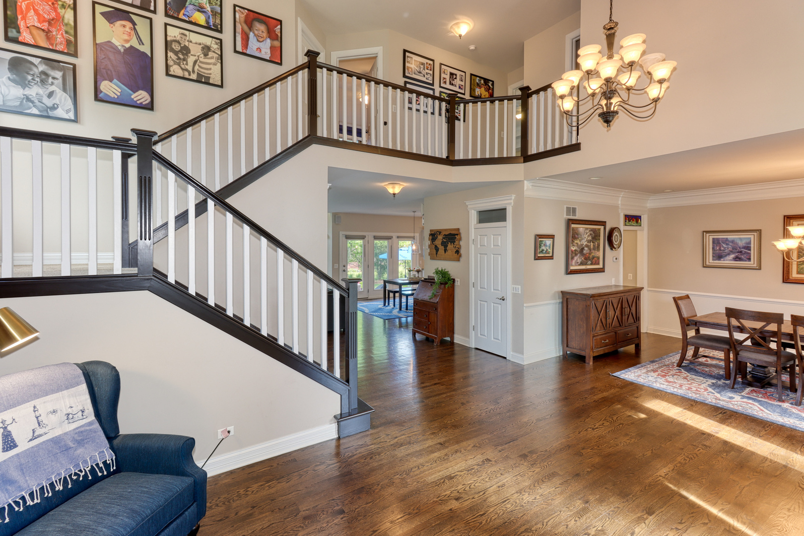 741 Merrill New Road Sugar Grove, IL 60554 - Photo 7 of 42 a view of a livingroom with furniture stairs wooden floor and a chandelier