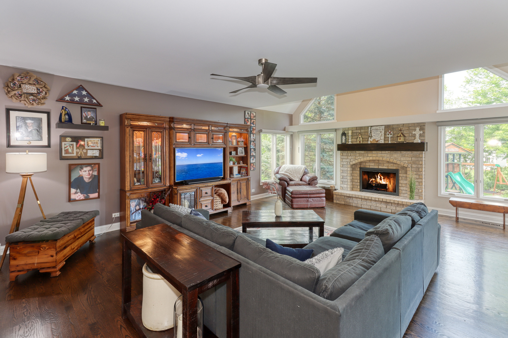 741 Merrill New Road Sugar Grove, IL 60554 - Photo 10 of 42 a living room with furniture a fireplace and a flat screen tv