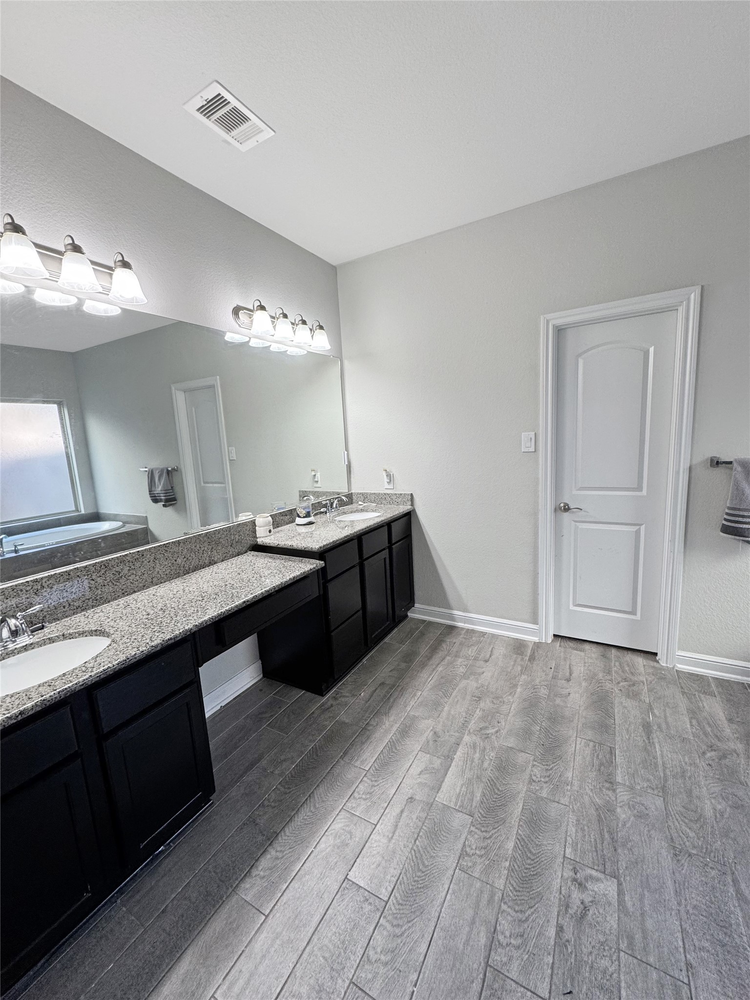 4922 Lacebark Pne Trail Rosenberg, TX 77471 - Photo 20 of 22 a bathroom with a double vanity sink and a mirror
