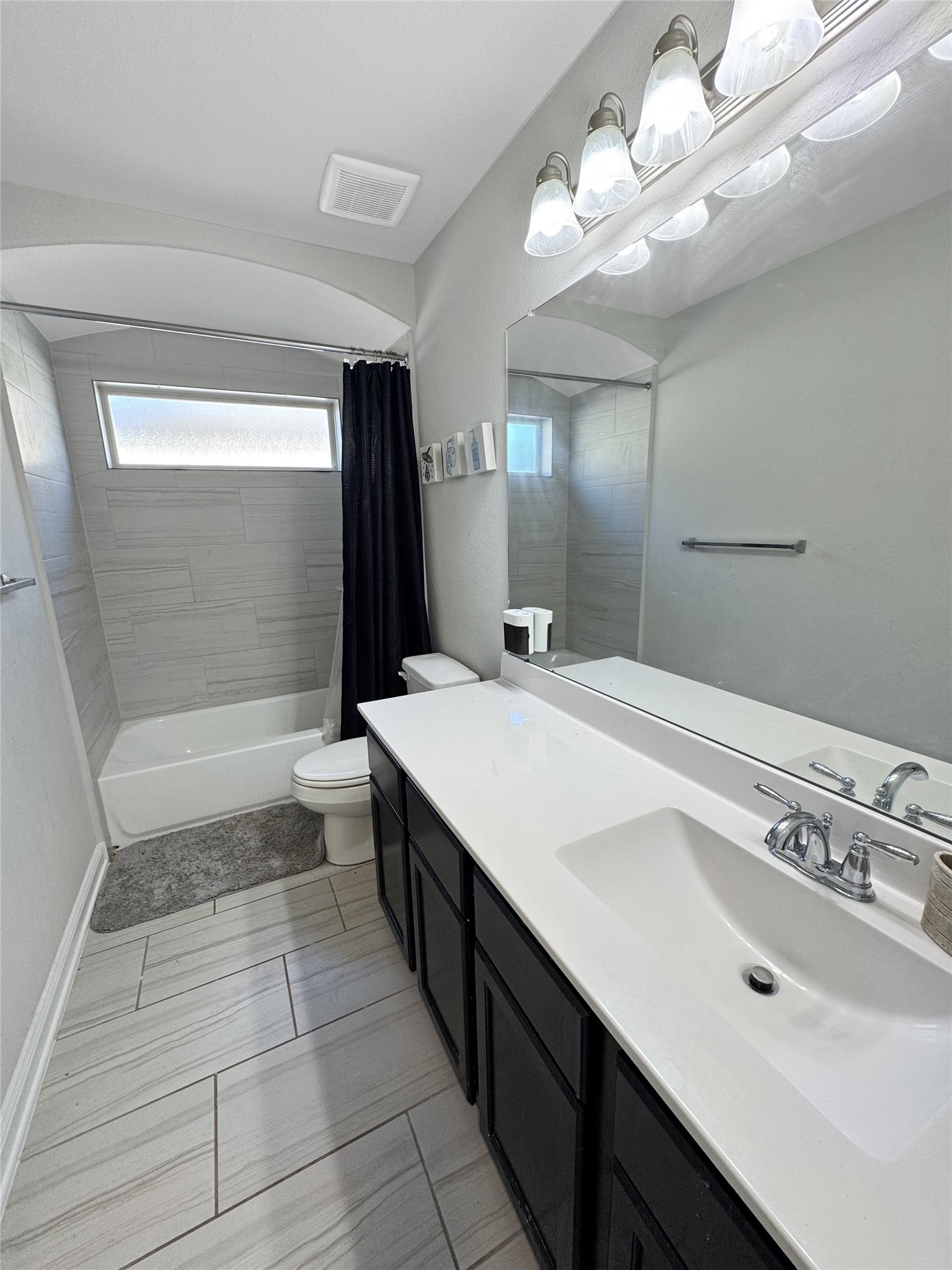 4922 Lacebark Pne Trail Rosenberg, TX 77471 - Photo 6 of 22 a bathroom with a sink a toilet a mirror and shower
