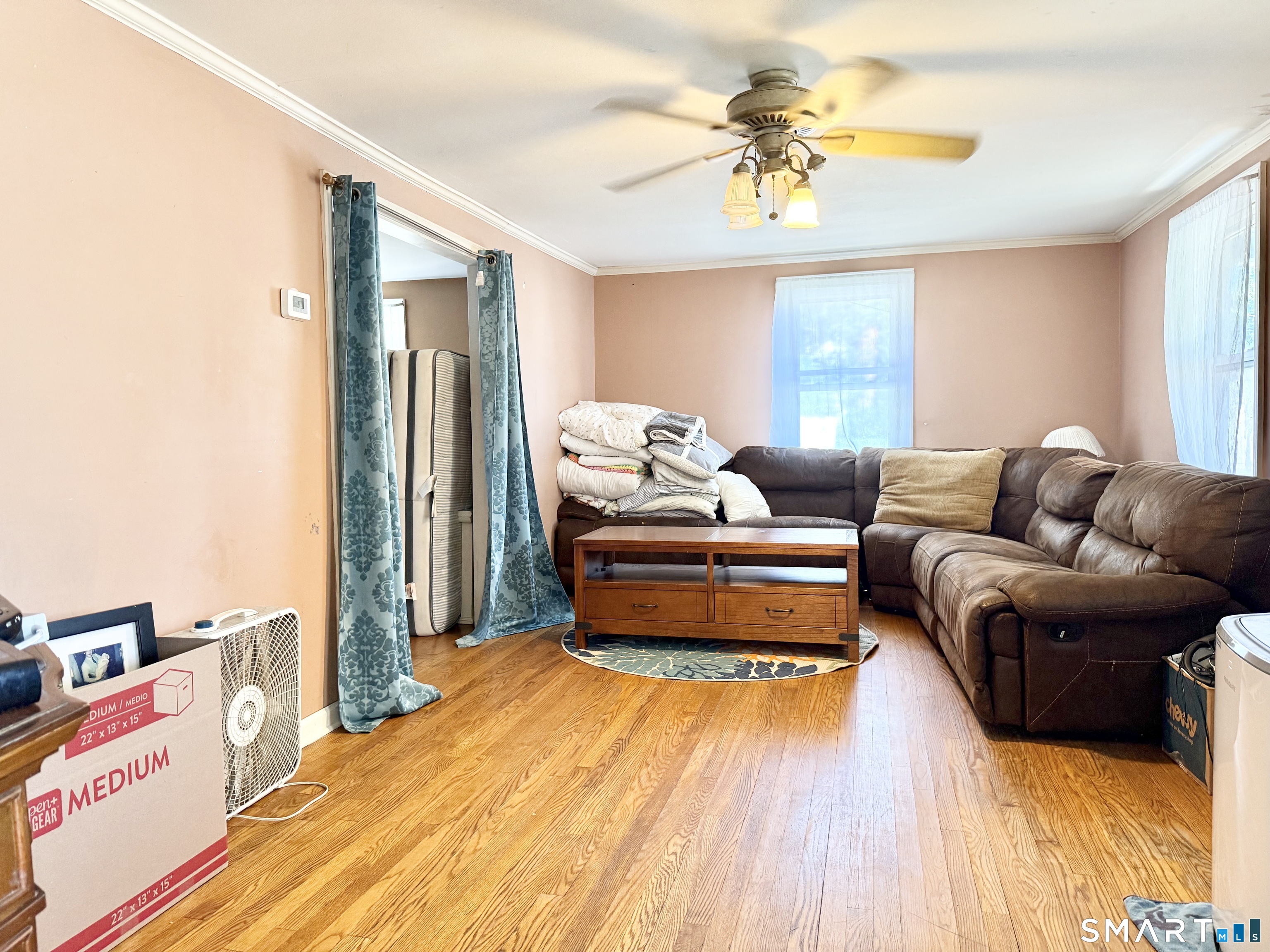 647 Bronson Road Fairfield, CT 06890 - Photo 12 of 21 a bedroom with furniture and a chandelier