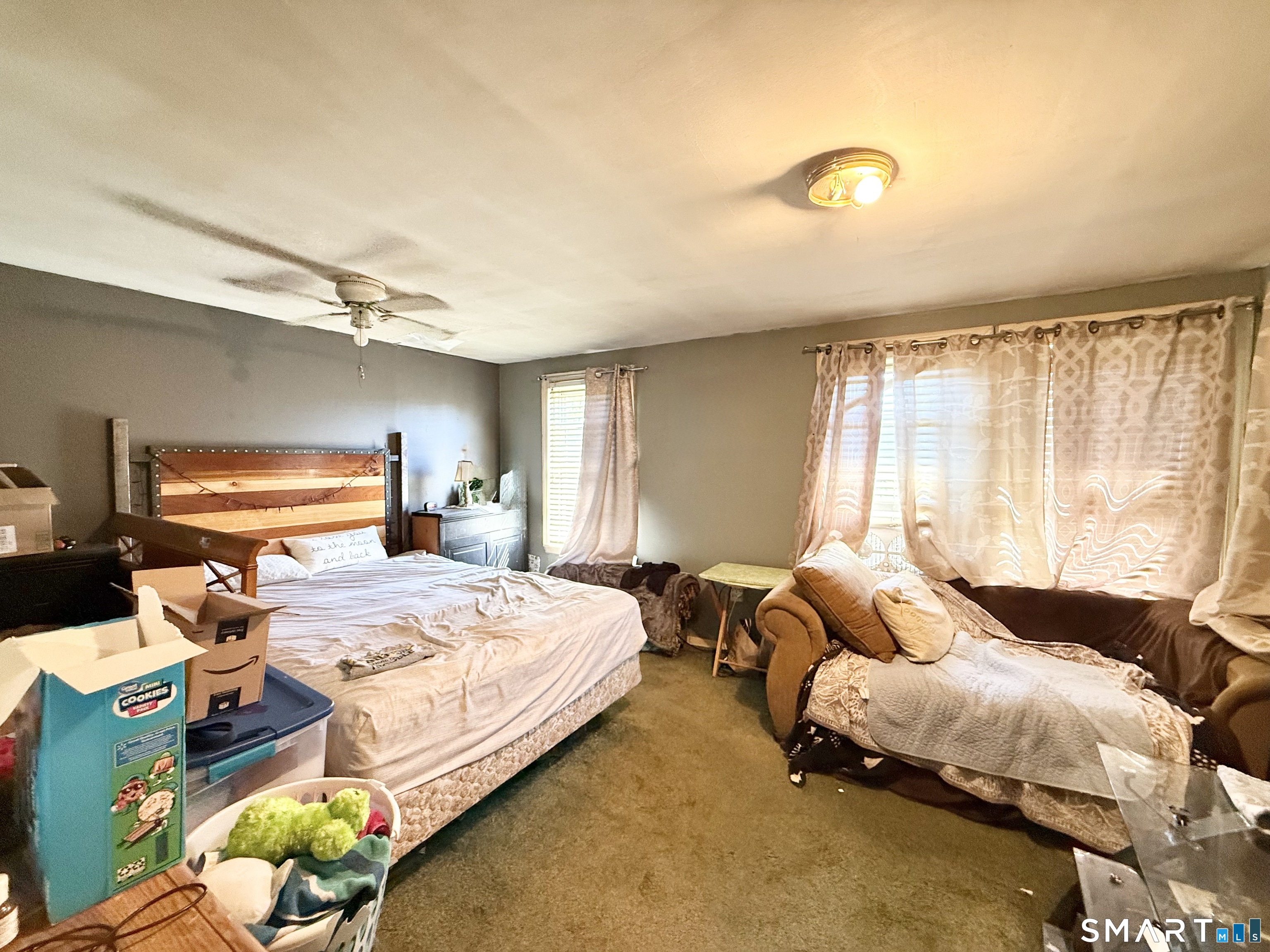 647 Bronson Road Fairfield, CT 06890 - Photo 20 of 21 a bedroom with a bed and a window