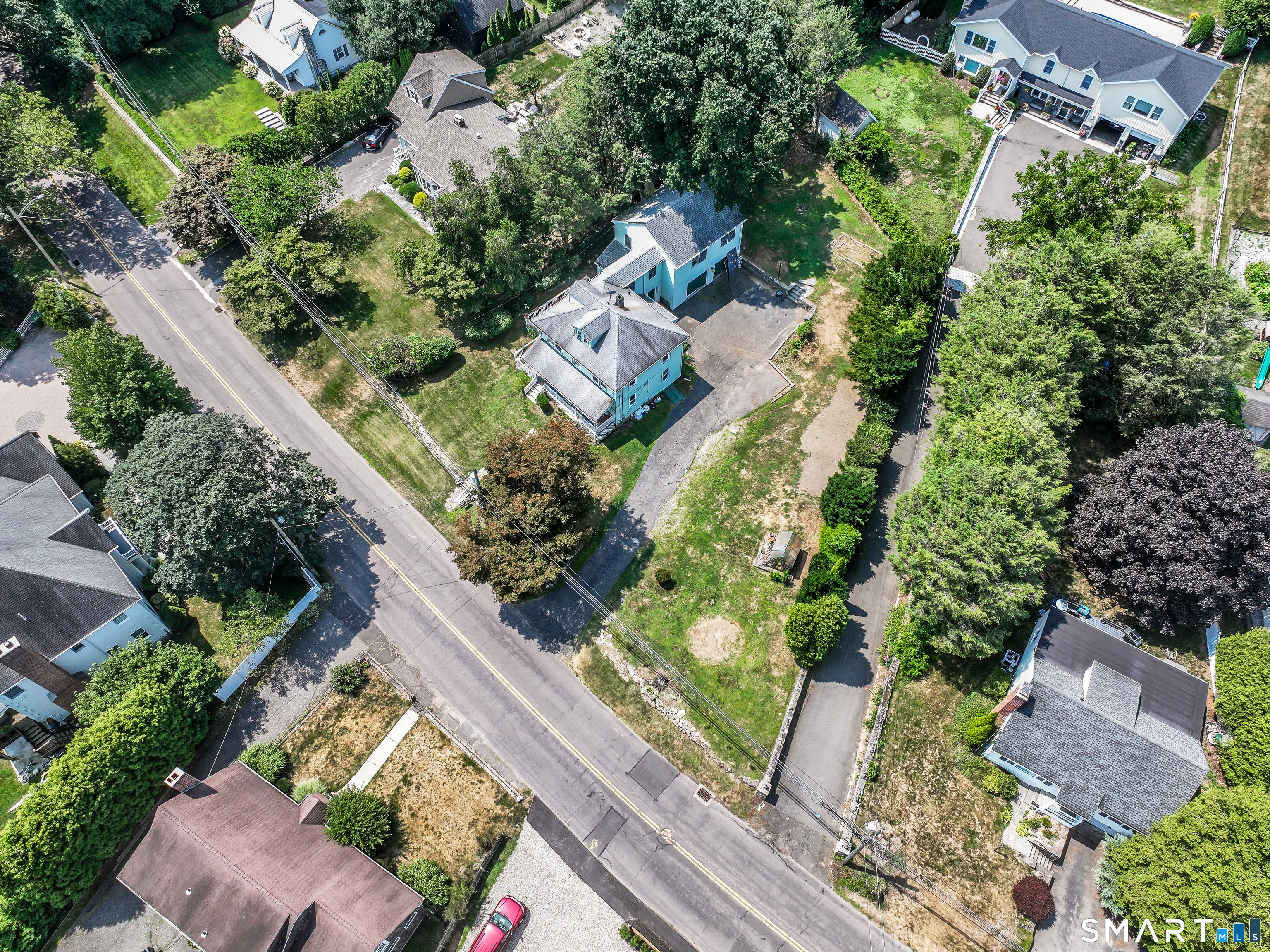 647 Bronson Road Fairfield, CT 06890 - Photo 2 of 21 an aerial view of a house with a yard