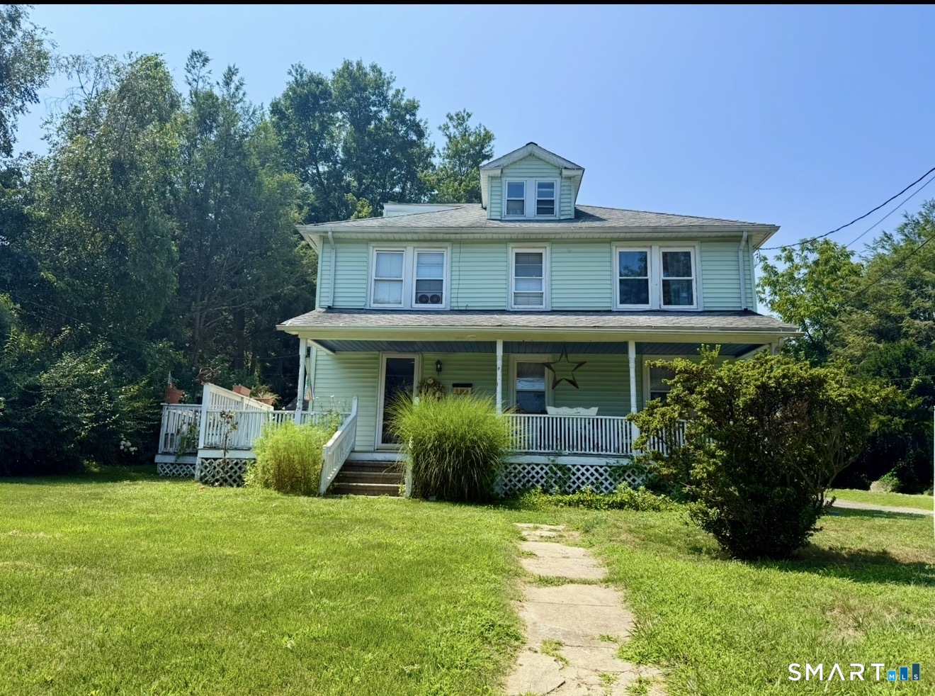 647 Bronson Road Fairfield, CT 06890 - Photo 5 of 21 a view of a house with garden and yard