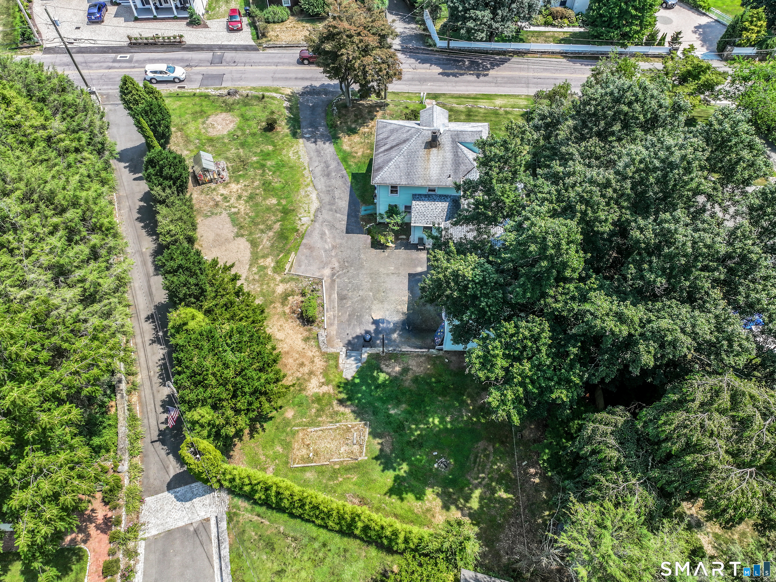 647 Bronson Road Fairfield, CT 06890 - Photo 7 of 21 an aerial view of house with yard and outdoor seating