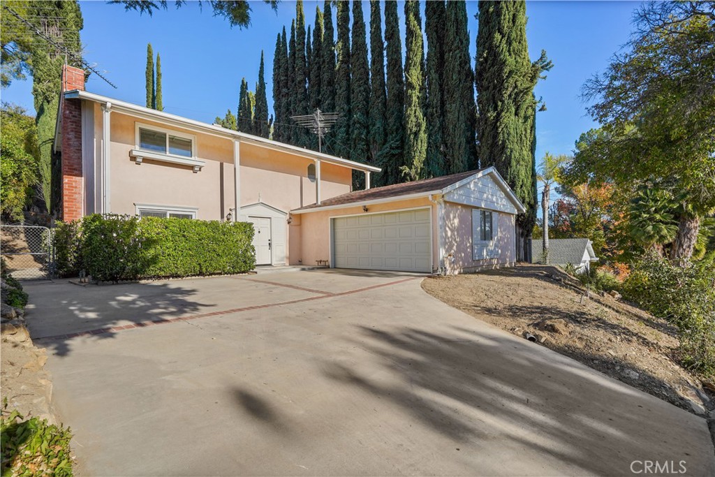 5850 Greenview Road Calabasas, CA 91302 - Photo 1 of 1 a view of a house with a backyard