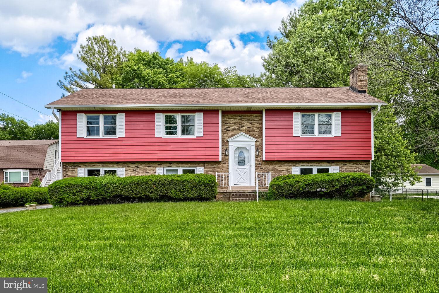 719 South Marlyn Avenue Baltimore, MD 21221 - Photo 2 of 39 a front view of a house with a yard