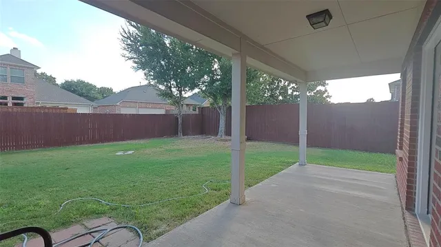 a view of backyard with garden and entertaining space