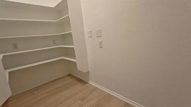 a view of an empty walk in closet